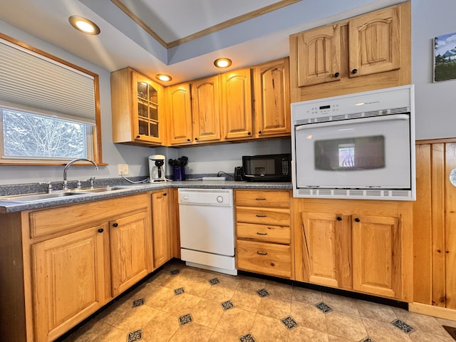 kitchen featuring sink, a tray ceiling, and white appliances