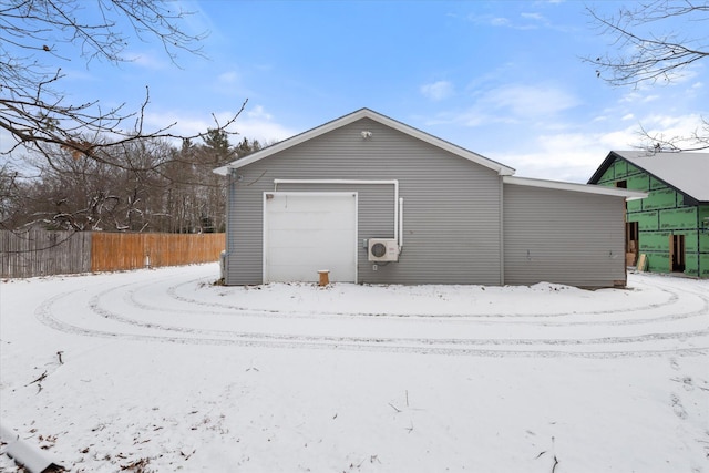 view of snow covered garage