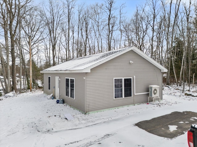 view of snow covered exterior featuring ac unit