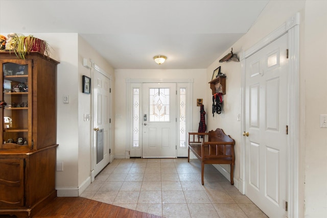 entrance foyer with light tile patterned floors