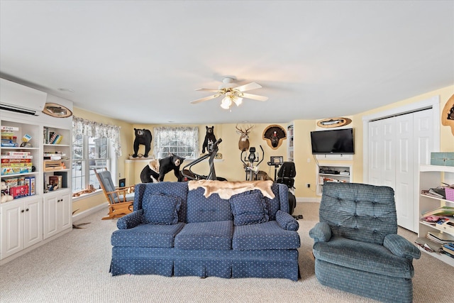 carpeted living room with ceiling fan and a wall mounted air conditioner