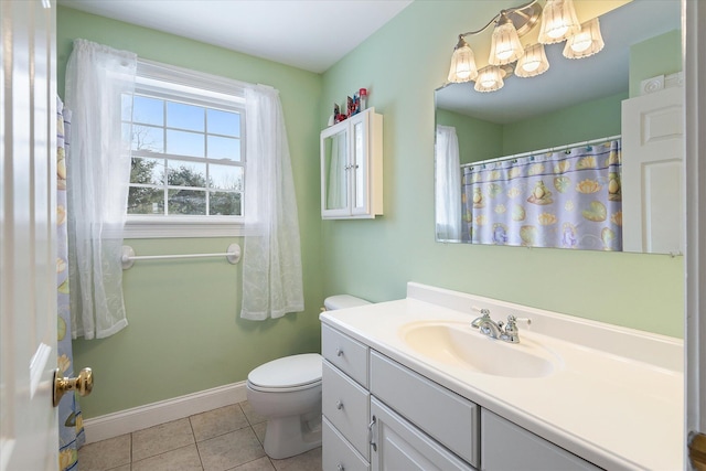 12 Ashlee Ln, Orrington, ME 04474 - full bath with tile patterned flooring, vanity, toilet, baseboards, and a chandelier