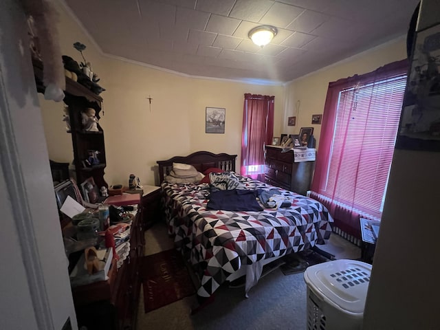 carpeted bedroom featuring ornamental molding