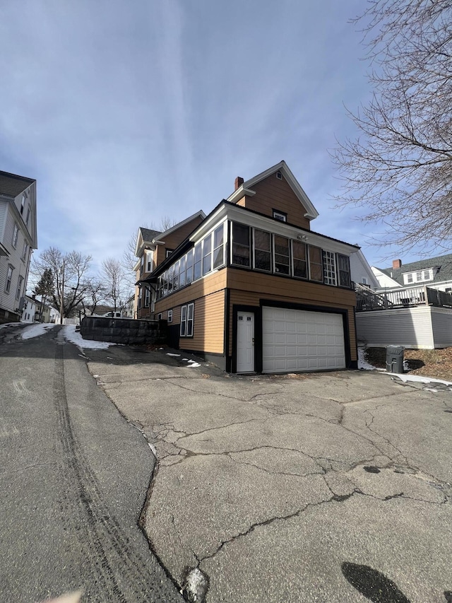 view of property exterior featuring a garage