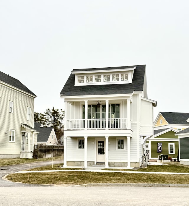 view of front of home with a balcony