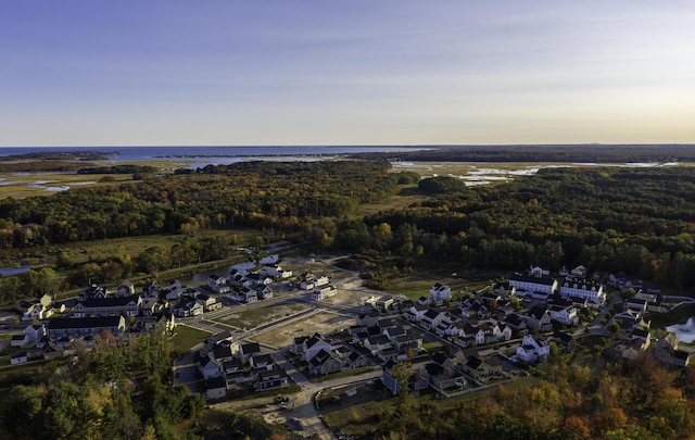 aerial view at dusk with a water view