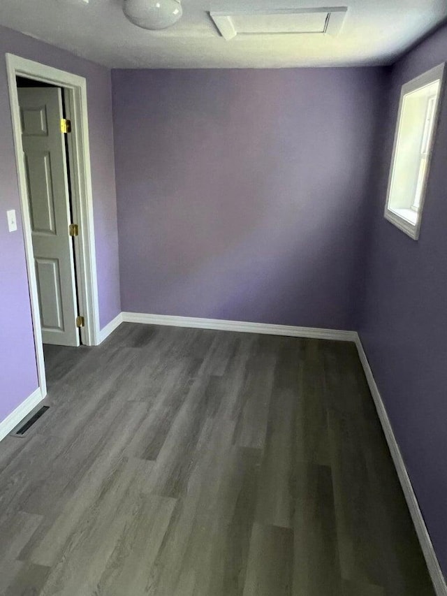 spare room with wood-type flooring