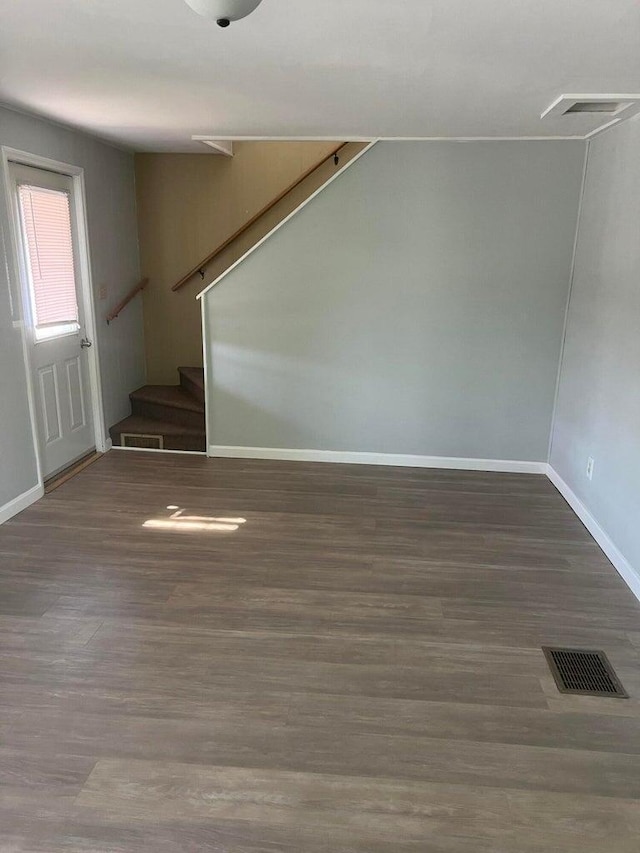 unfurnished room with hardwood / wood-style flooring