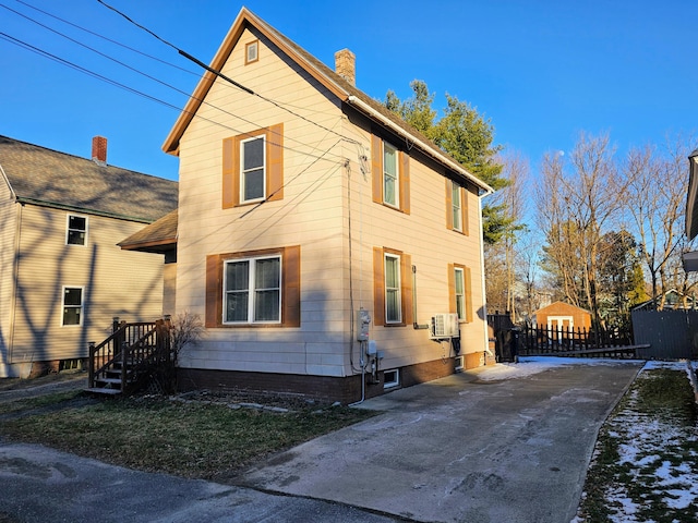 view of side of home with cooling unit