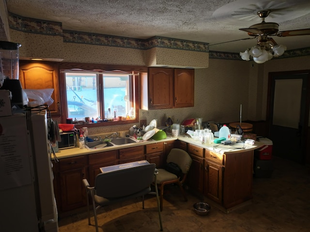 kitchen with ceiling fan and sink