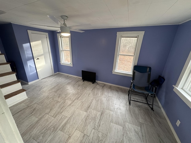 unfurnished room with ceiling fan