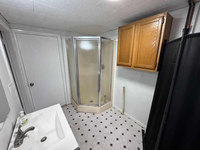 bathroom with sink and walk in shower