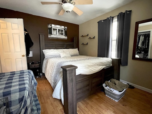 bedroom featuring wood-type flooring and ceiling fan