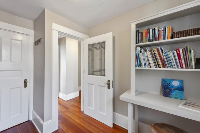 hallway featuring hardwood / wood-style flooring