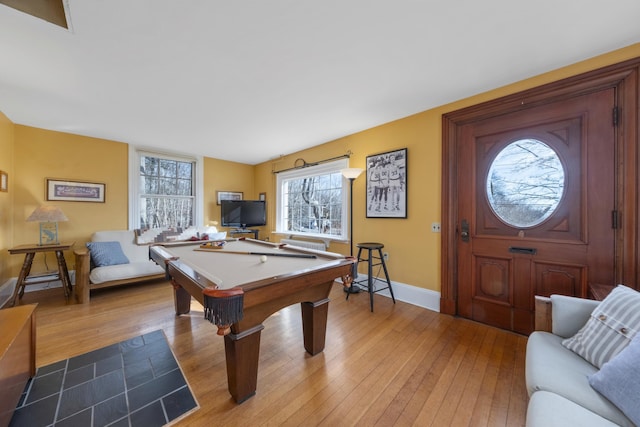 recreation room with billiards and light hardwood / wood-style flooring