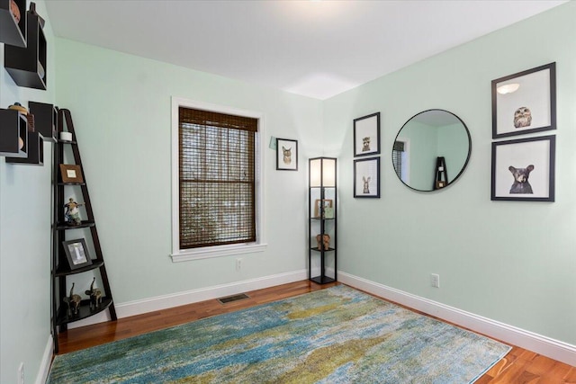 empty room featuring hardwood / wood-style flooring