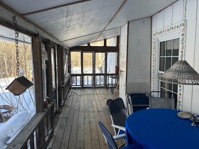 sunroom featuring lofted ceiling