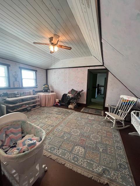 living room featuring vaulted ceiling and wooden ceiling