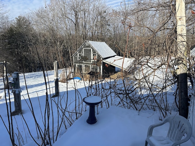 view of yard layered in snow