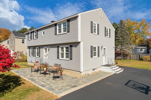 rear view of property featuring a patio