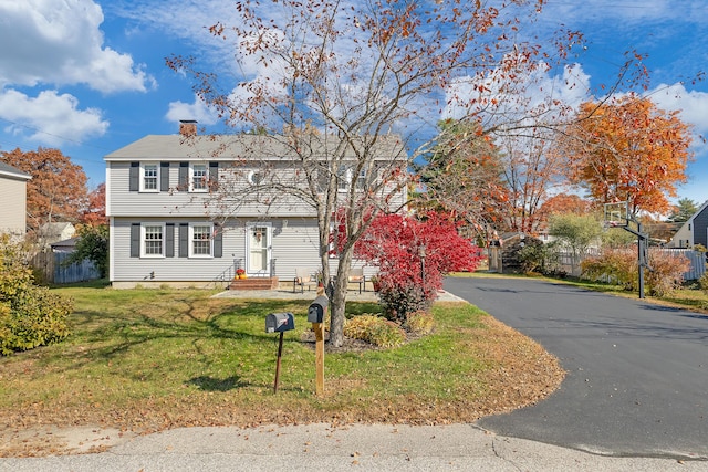 view of front of home with a front lawn