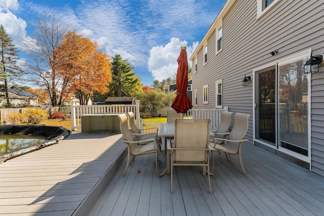 deck with a hot tub