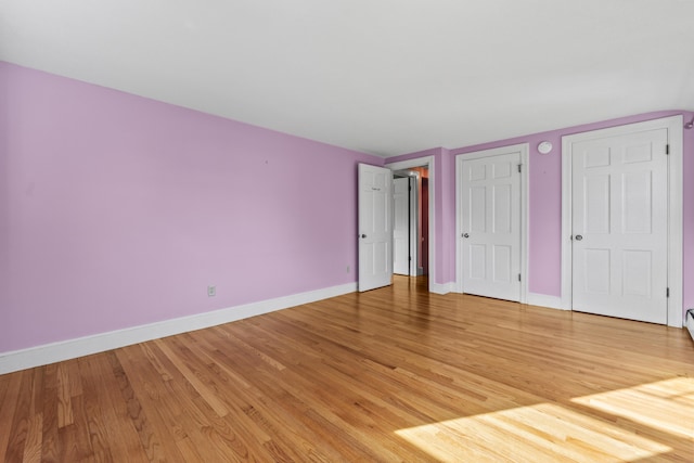 unfurnished bedroom featuring light wood-type flooring