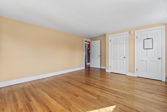 unfurnished bedroom featuring light wood-type flooring