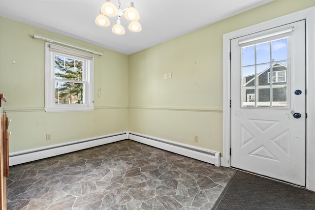 interior space with a baseboard heating unit and a chandelier