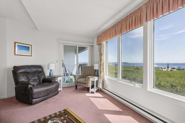 interior space with plenty of natural light, a water view, and baseboard heating