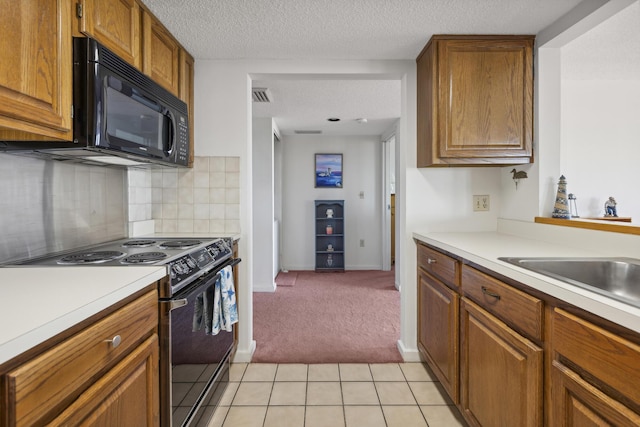 kitchen with backsplash, a textured ceiling, light colored carpet, sink, and black appliances