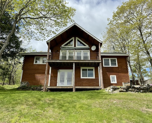 rear view of house with a yard