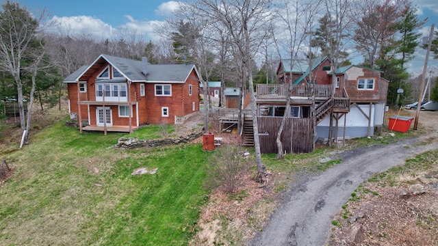 exterior space with a yard and a wooden deck