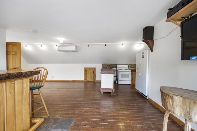 bar with a wall mounted AC, white appliances, and dark wood-type flooring