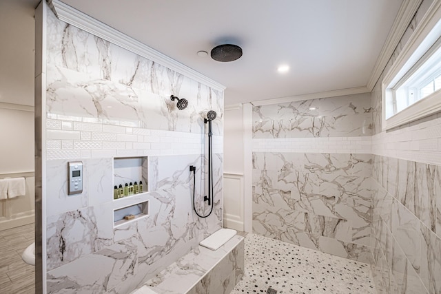 bathroom with ornamental molding and a tile shower