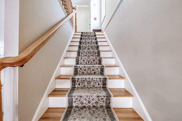 stairway featuring hardwood / wood-style flooring