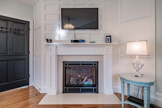 interior space featuring ornamental molding and hardwood / wood-style flooring