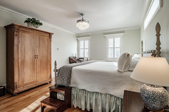 bedroom featuring an inviting chandelier, crown molding, and hardwood / wood-style floors