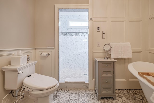 bathroom with toilet, tile patterned flooring, and a bathtub