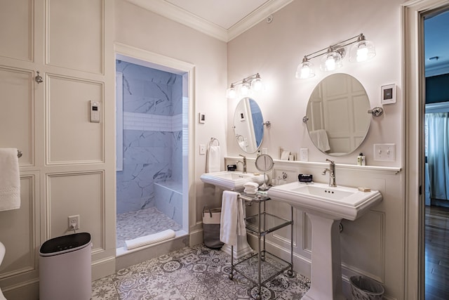 bathroom with tiled shower and crown molding