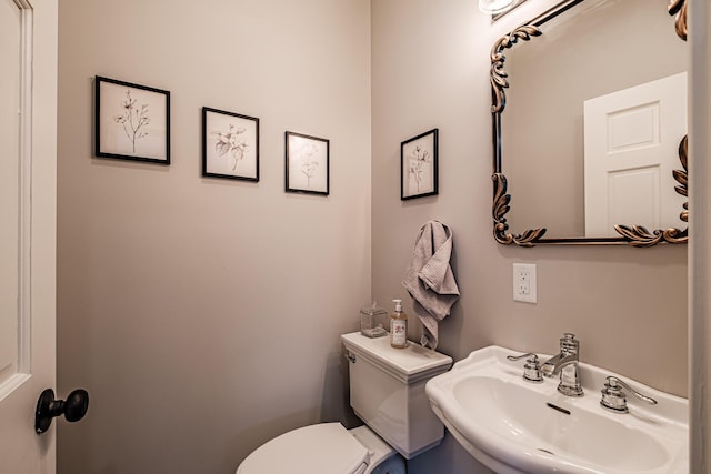 bathroom with sink and toilet