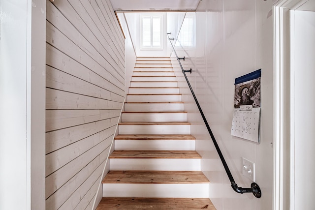 stairs with wood walls