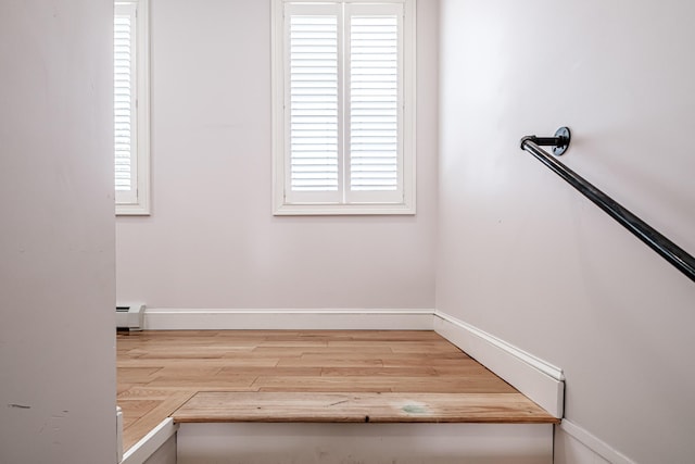 staircase with wood-type flooring