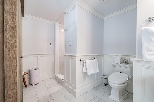 bathroom with toilet, a shower, and crown molding