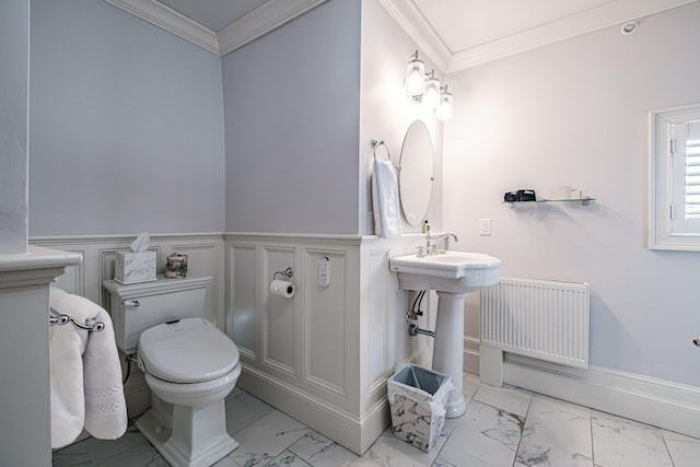 bathroom featuring toilet, crown molding, and radiator heating unit