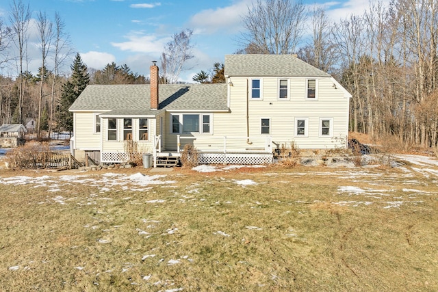 back of house featuring a yard