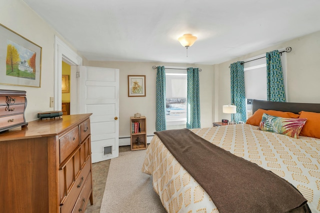 bedroom with light colored carpet and a baseboard radiator