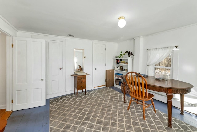 home office with dark hardwood / wood-style flooring and ornamental molding