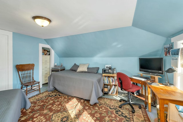 bedroom featuring lofted ceiling