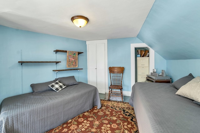 bedroom with lofted ceiling